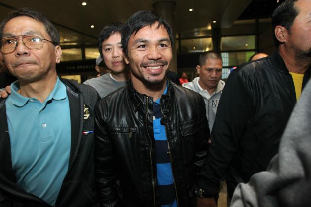 l_ff756c67eddb97fbab01d2d5164e549cPacquiao_LAXarrival_140308_001a.jpg